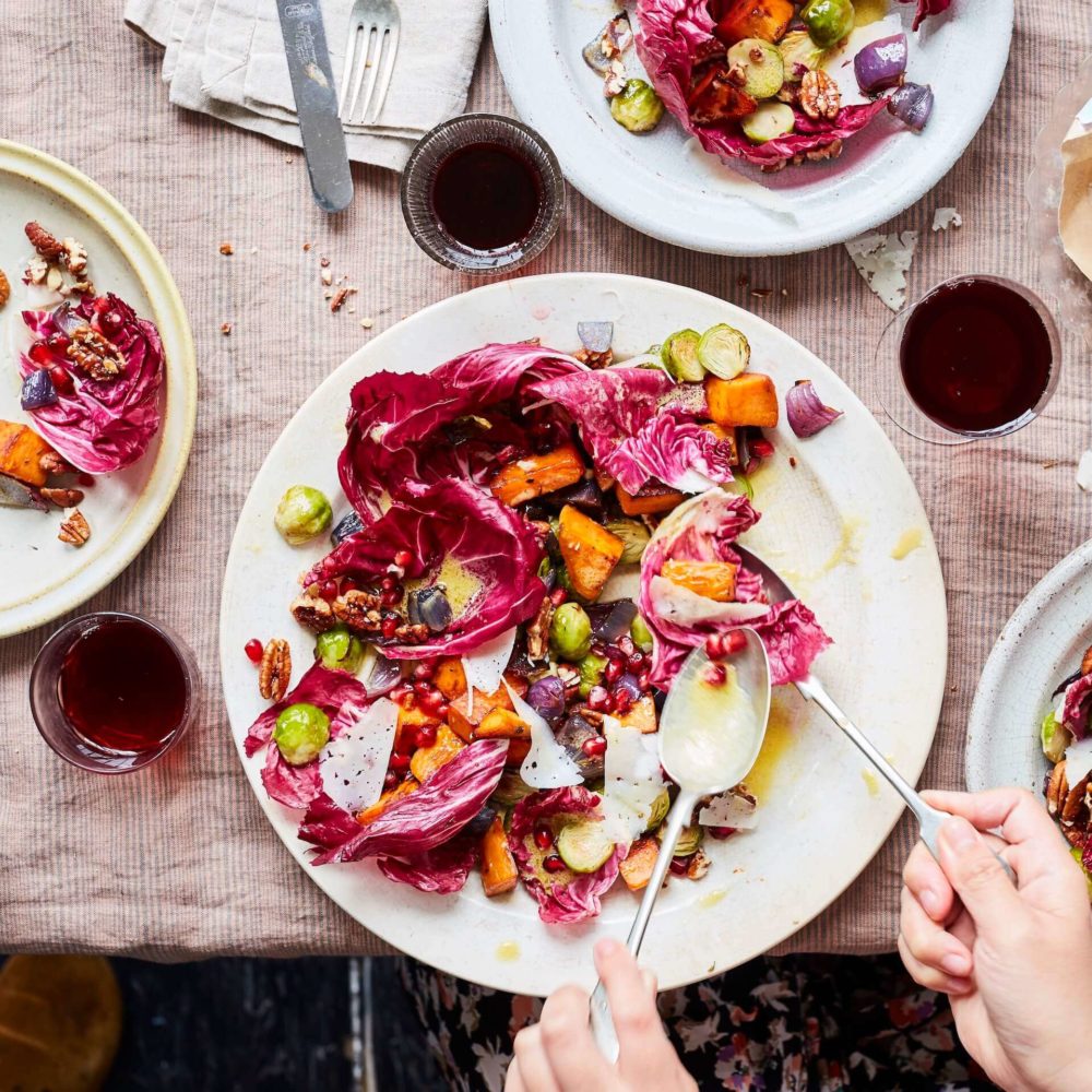 A big beautiful Thanksgiving salad with sweet potato and sprouts