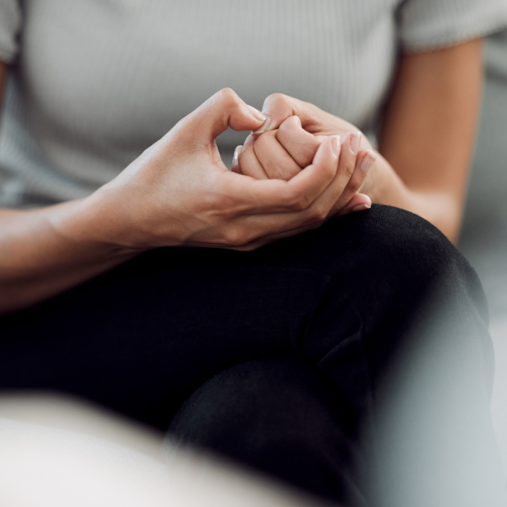 Illustration of hand helping someone struggling with anxiety